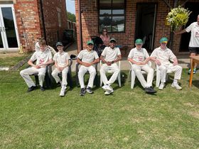 Young Clifton Alliance cricketers wait to bat